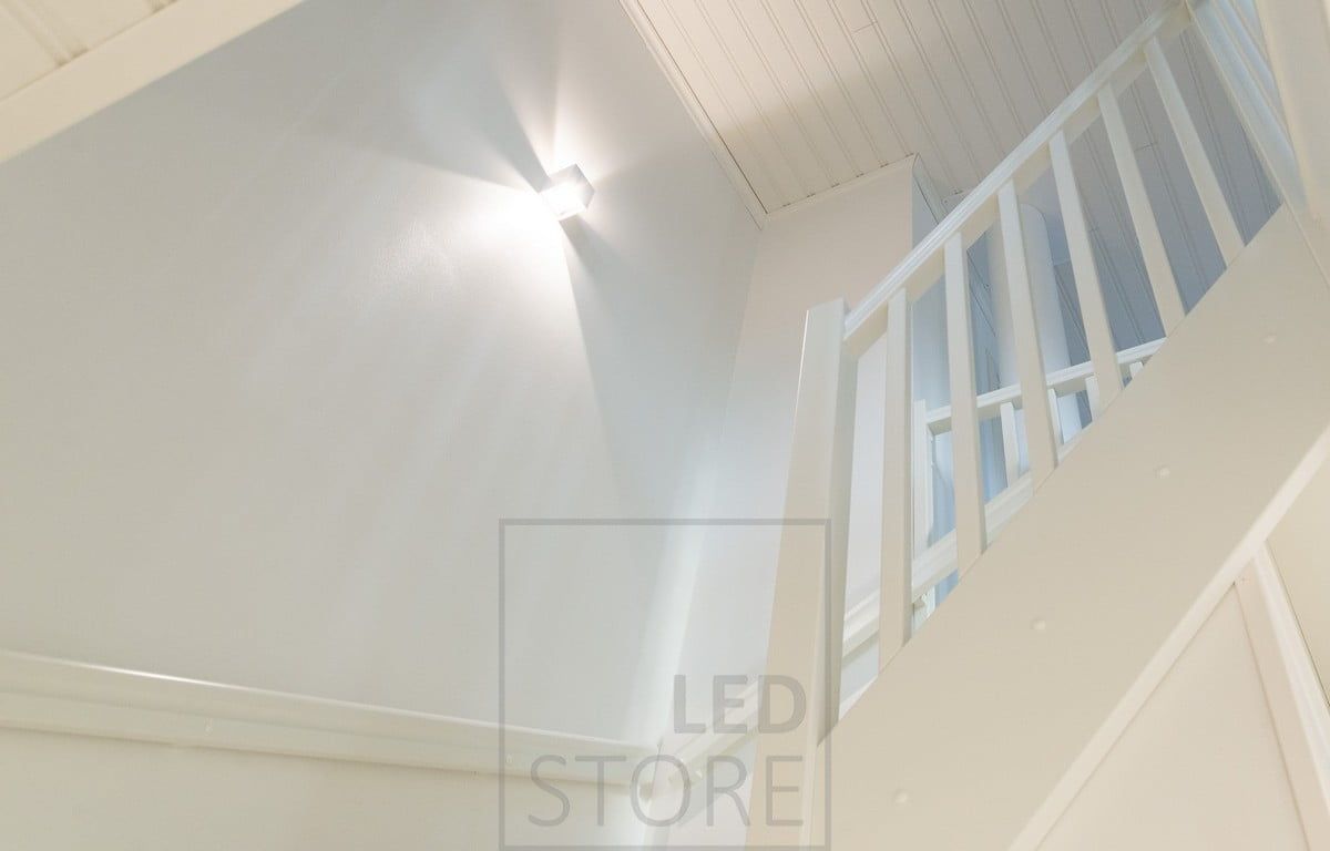 The staircase illuminated by a FUNK wall light.